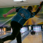 Image of Tenping Bowler releasing ball down alley
