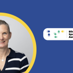 Felicity Wilkeson smiling in a portrait, wearing a navy-and-white striped collared shirt. She is framed within a yellow circle on a teal and dark-blue graphic background, with the Blind Sports Australia logo in the upper-right corner.