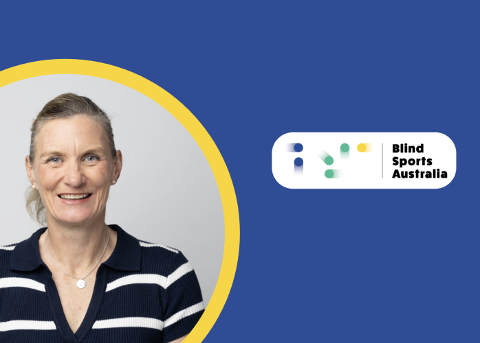 Felicity Wilkeson smiling in a portrait, wearing a navy-and-white striped collared shirt. She is framed within a yellow circle on a teal and dark-blue graphic background, with the Blind Sports Australia logo in the upper-right corner.