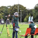 Australian Blind and Low Vision Archer Janelle Colquhoun and spotter Paul Fruhwirth in competition on the archery field during the 2023 IBSA world blind games